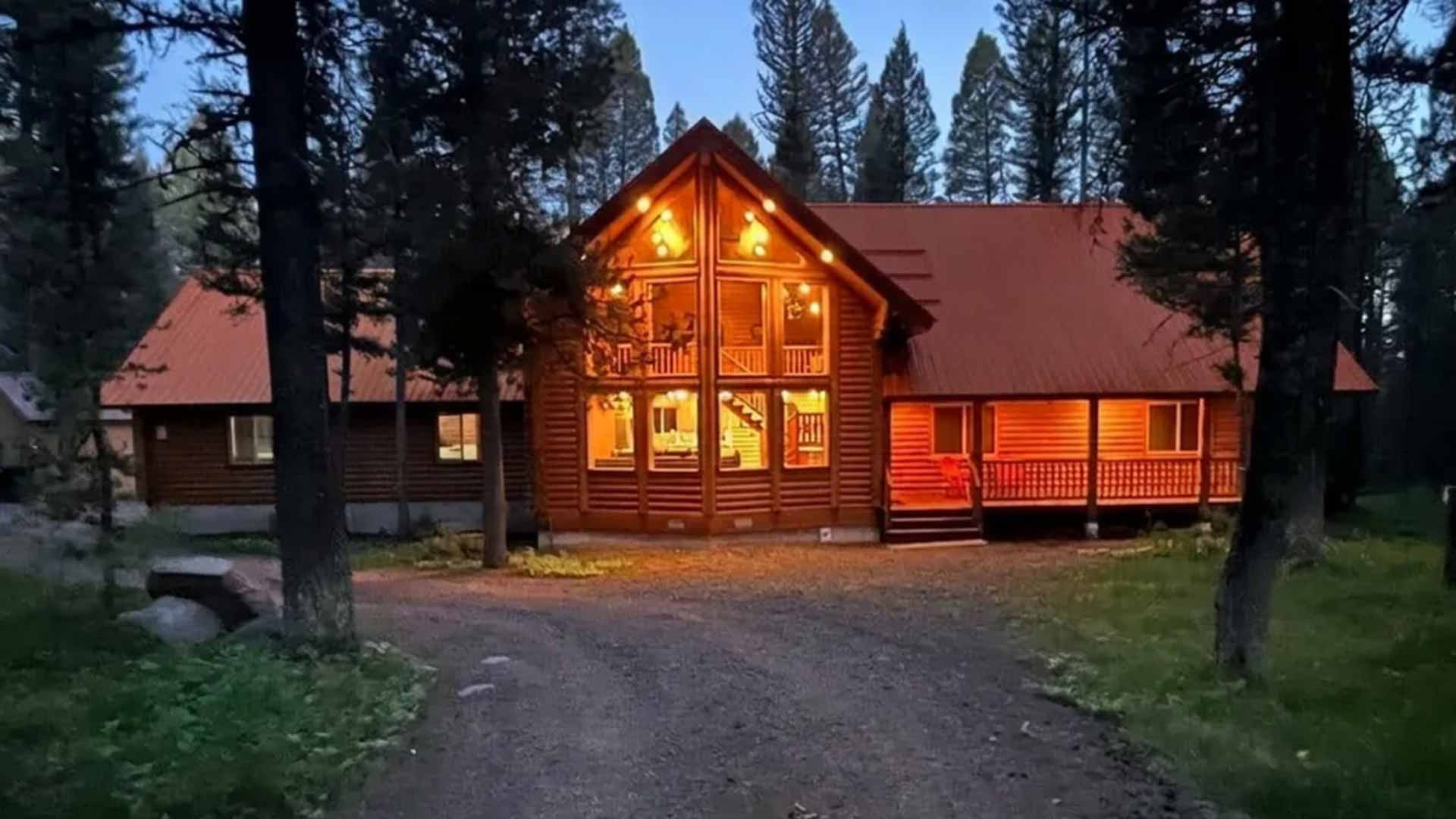 Lodgepole Pines Retreat lit up in the evening in the Targhee National Forest