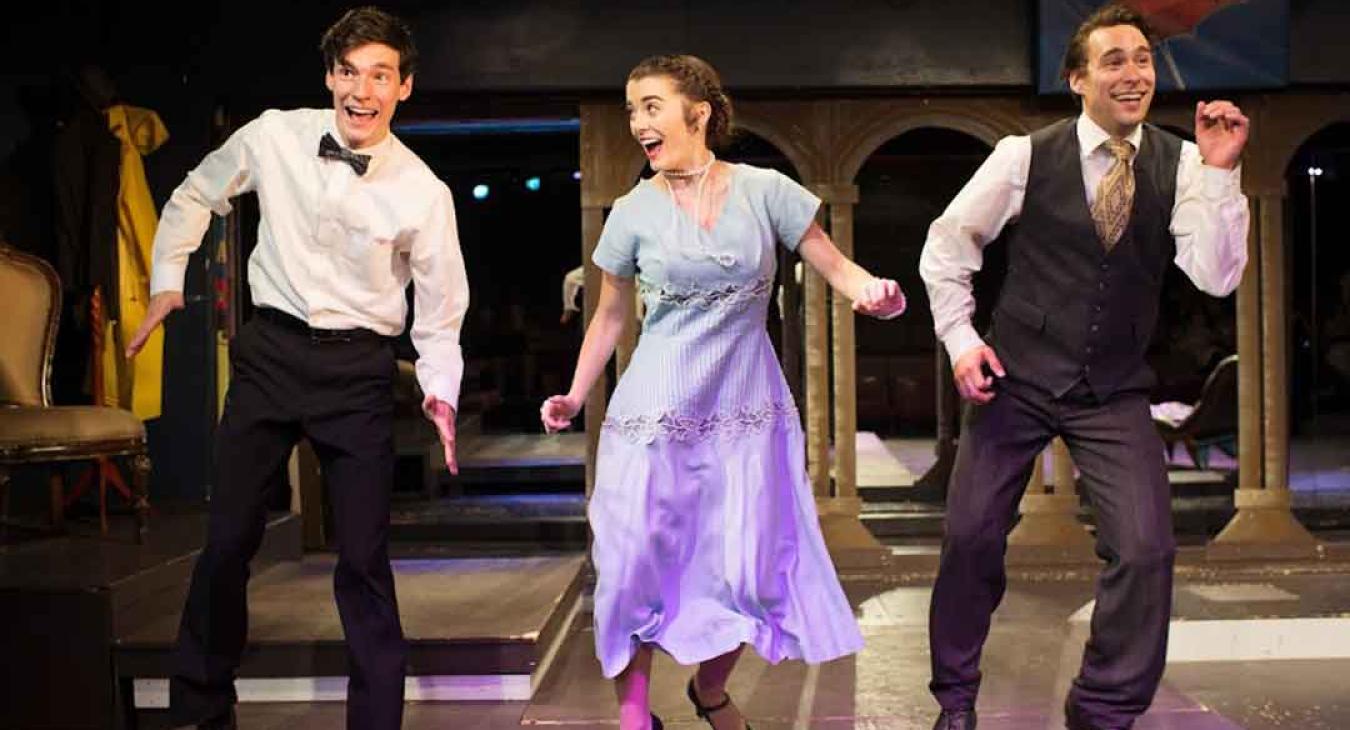 Playmill Theatre cast performing Singing in the Rain on stage at Island Park Idaho