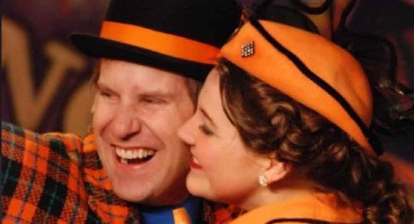 Two Playmill Theatre performers laughing in colorful costumes during live show in Island Park Idaho