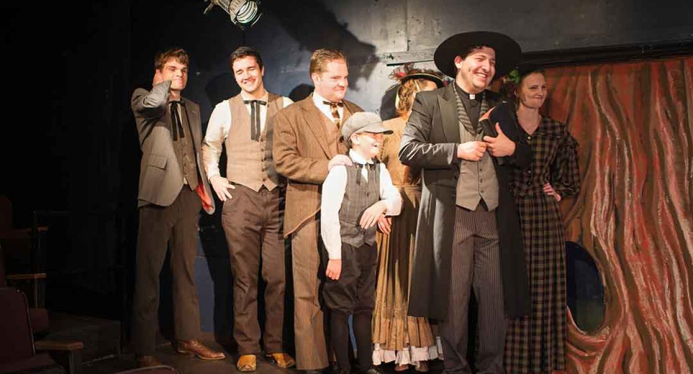 Playmill Theatre cast taking a bow on stage after live performance in Island Park Idaho